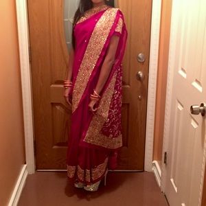 Red heavily decorated Indian sari